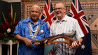 Fiji prime minister  Frank Bainimarama presents Australian Prime Minister Anthony Albanese with a Wau war club during a bilateral meeting at the Pacific Islands Forum on Wednesday.