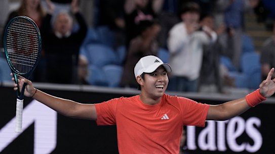 Learner Tien of the US celebrates after beating Daniil Medvedev.