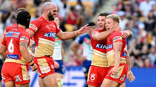 Max Plath of the Dolphins celebrates with teammates after scoring a try during the round 27 match.