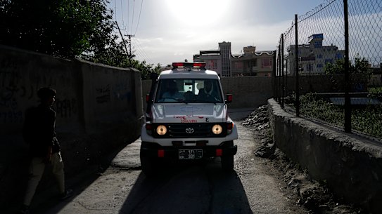 Ambulance carrying wounded people leaves the site of an explosion.