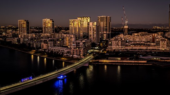 The government will reward councils that take on more development. Pictured is the riverside suburb of Rhodes at sunset.