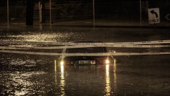 A car is submerged in flood waters in Chipping Norton. The area is now flooding for the fourth time this year.
