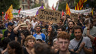 Demonstrators march shouting slogans against the Formula 1 Barcelona Fan Festival in downtown Barcelona, Spain.