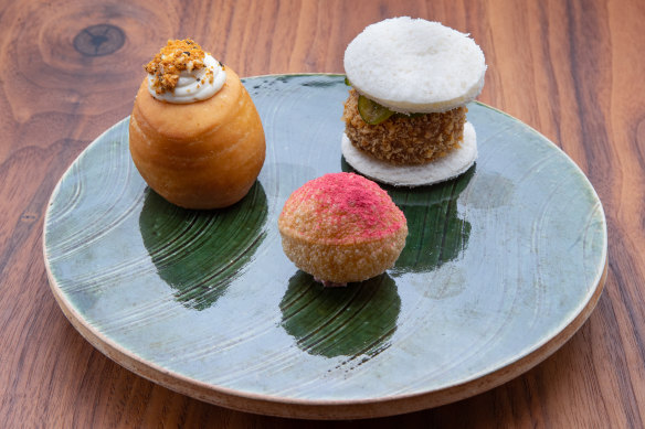 Pani puri filled with duck parfait and raspberry, duck katsu sandwich, and a doughnut cooked in duck fat. 