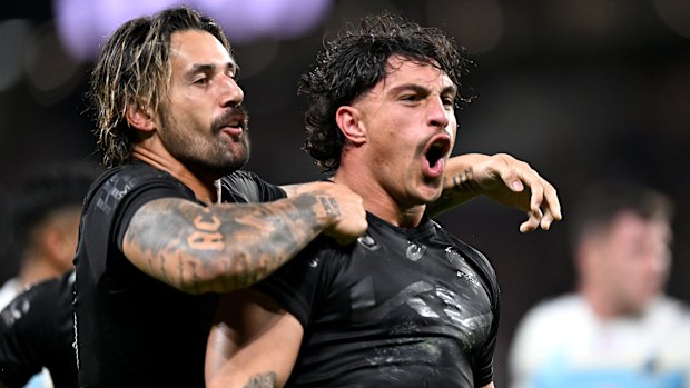 Kotoni Staggs celebrates scoring for the Brisbane Broncos against the Gold Coast Titans.