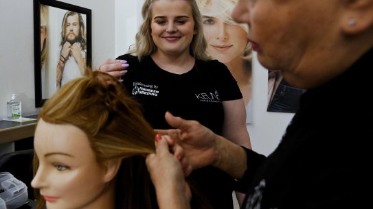 Hairdressing apprentice Lily Wickett, 17, has no regrets about leaving school before completing year 10.