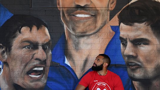 New Canterbury Bulldogs recruit Josh Addo-Carr in front of a Bulldogs mural at Jobels Cafe.