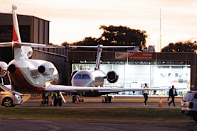 Jarome Luai landed in Sydney on a private jet on Monday night after a visit to Papua New Guinea.