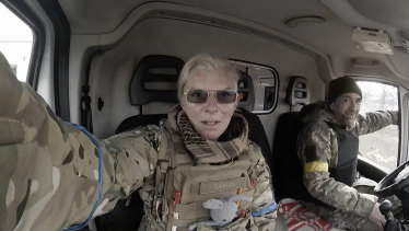 Yuliia Paievska, known as Taira, and her driver Serhiy sit in a vehicle in Mariupol, Ukraine. She last appeared on March 21 on Russian television as a captive, handcuffed.
