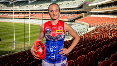 Daisy Pearce will play on with Melbourne for at least one more AFLW season.