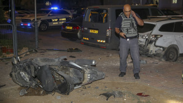 Israeli security at the site where a missile from Gaza Strip hit the town of Sderot on Wednesday.
