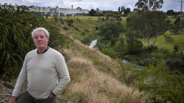 Fawkner resident Brian Snowden at the rear of the contaminated site approved for redevelopment.