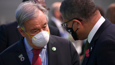 United Nations Secretary-General Antonio Guterres locked in discussions with COP26 President Alok Sharma.