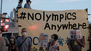 Demonstrators during an anti-Olympic protest in the Harajuku district of Tokyo, Japan, on Friday.