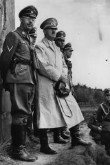 Police chief Heinrich Himmler, who was second in ranking only to Adolf Hitler himself, stands next to the German dictator.