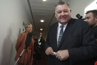 Craig Kelly walks away from Tanya Plibersek.