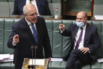 Prime Minister Scott Morrison and Treasurer Josh Frydenberg during Question Time at Parliament House in Canberra.