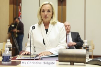 Christine Holgate takes her seat at the start of the Senate hearing on Australia Post at Parliament House.