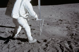 Buzz Aldrin walks on the dusty lunar surface during Apollo 11 extravehicular activity in 1969.