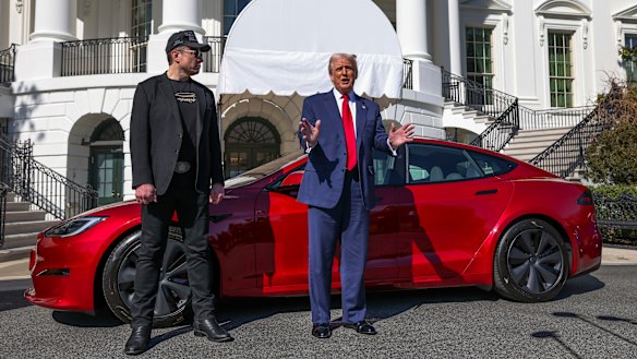 Donald Trump (right) said he would buy a Tesla in a show of support for the electric car-marker led by Elon Musk (left).