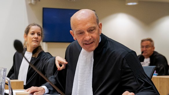 Sabine ten Doesschate, left, and Boudewijn van Eijck, lawyers for one of the four suspects, Russian Oleg Pulatov, are seen at the trial at the high security court building at Schiphol Airport, near Amsterdam. 