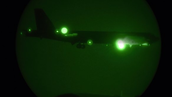 A B-52H seen through night vision coming in for a landing at Al Udeid Air Base, Qatar.
