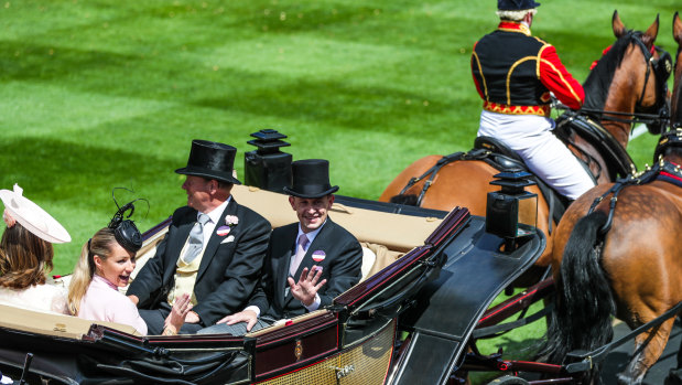On a roll: Chris Waller and wife Stephanie give the royal wave at Ascot.