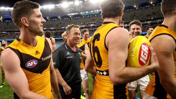 Alastair Clarkson and the Hawks celebrate after beating the Eagles.