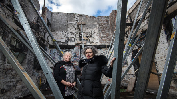 Liz Jones and Judith Lucy in the ruins of La Mama theatre.