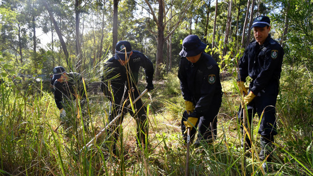 Officers near bushland in Kendall in the hunt for forensic clues.