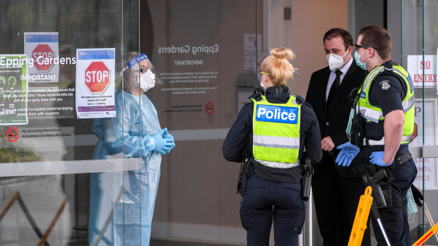 Police and workers at the Epping Gardens Aged Care Facility in Epping in Melbourne's north on Wednesday.