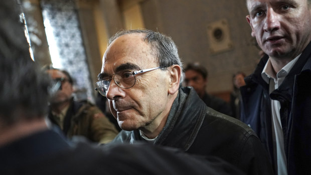 French Cardinal Philippe Barbarin, centre, arrives at the Lyon courtroom for his appeal trial on Thursday.