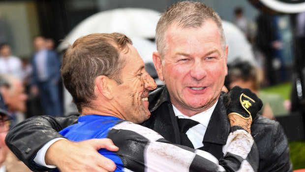 Hugh Bowman and Kris Lees embrace after Mugatoo’s All-Star Mile win in 2021.