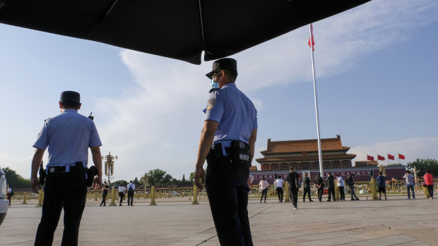 Two policemen are on duty in Tiananmen Square on Tuesday.