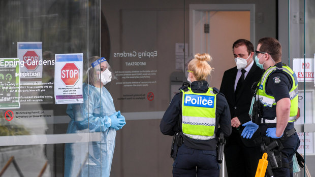 Police and workers at the Epping Gardens Aged Care Facility in Epping in Melbourne's north in July.