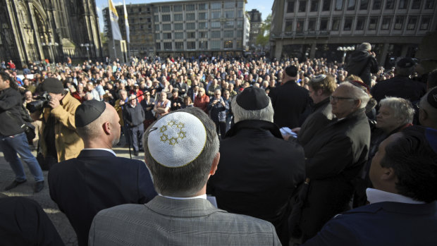 Germans of various faiths donned Jewish skullcaps and took to the streets on Wednesday in several cities to protest against an anti-Semitic attack in Berlin and express fears about growing hatred of Jews in the country. 