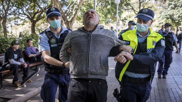 A man is arrested by police after attending a protest in Hyde Park. 