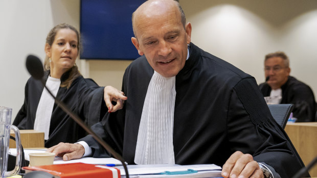 Sabine ten Doesschate, left, and Boudewijn van Eijck, lawyers for one of the four suspects, Russian Oleg Pulatov, are seen at the trial at the high security court building at Schiphol Airport, near Amsterdam. 