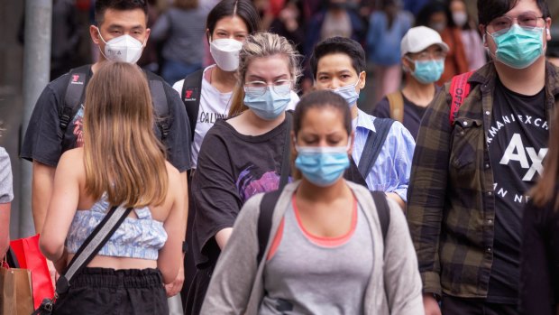 People wearing a range of face masks in Melbourne on Tuesday.