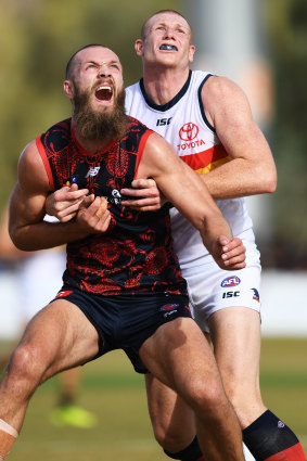 Max Gawn tangles with Sam Jacobs.