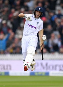 Joe Root, having made a century and passed 10,000 Test runs, celebrates the win. 