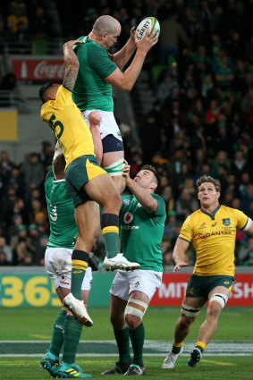 Blocked: Cian Healy controls a high-ball as Israel Folau comes up short.