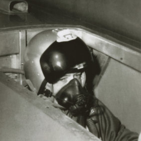 Donald Campbell seated in the cockpit of Bluebird prior to his record breaking run on Lake Eyre, 17 July 1964.
