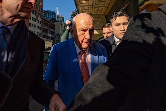 Jones is greeted by a media throng as he arrives at court.