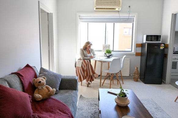 Dr Chelsea Tobin, seated in a Safe Steps crisis shelter unit, is determined to get Victorian women at risk of death by family violence into adequate accommodation and out of motels, where they can be left for days. 