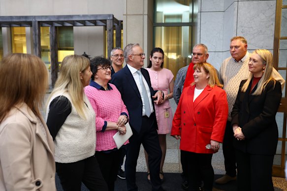 Prime Minister Anthony Albanese, centre, and Jodie Haydon, right, with friends he grew up with in what was then the working-class suburb of Camperdown in inner Sydney.