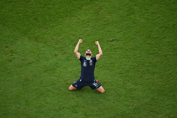 Aziz Behich celebrates after Australia’s win over Tunisia.