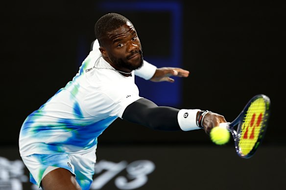 Frances Tiafoe of United States plays a backhand against Francisco Comesana of Argentina.