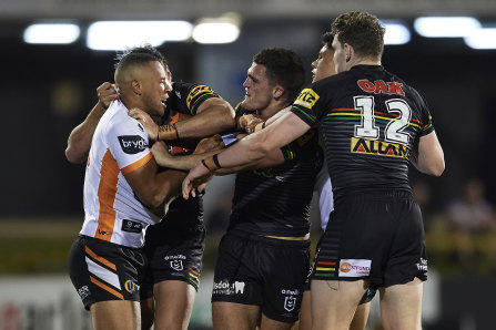 Let's dance ... Moses Mbye scuffles with Nathan Cleary last Saturday week.