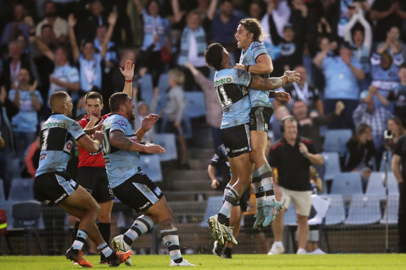 The Sharks celebrate Nicho Hynes’ match-winning conversion against the Eels in round two.